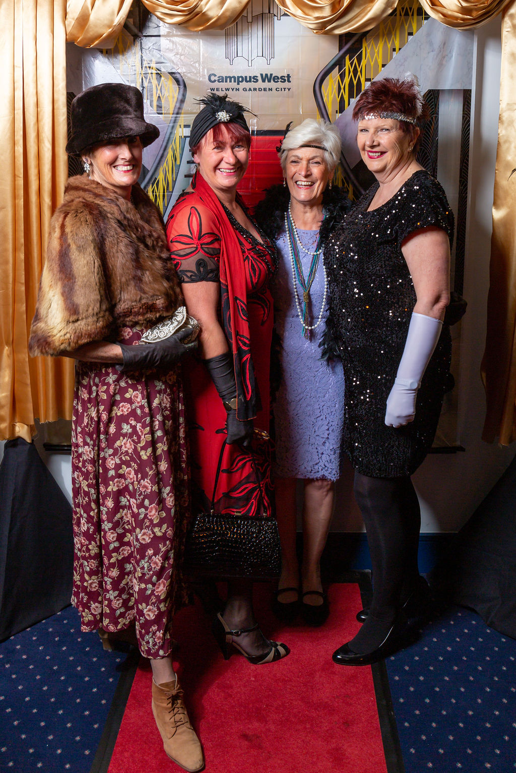4 ladies in 1920's attire at the Downton Abbey Gala Night.