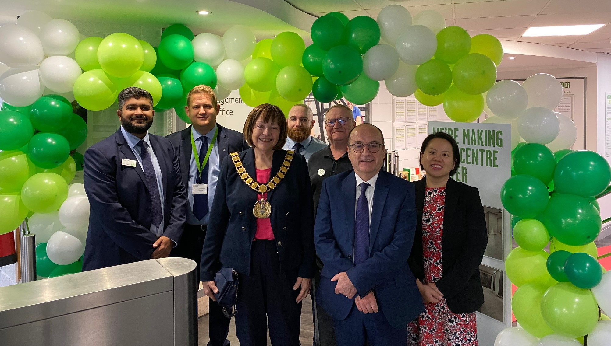 The Mayor and other senior staff members standing in front of balloons at the Hatfield Swim Centre.