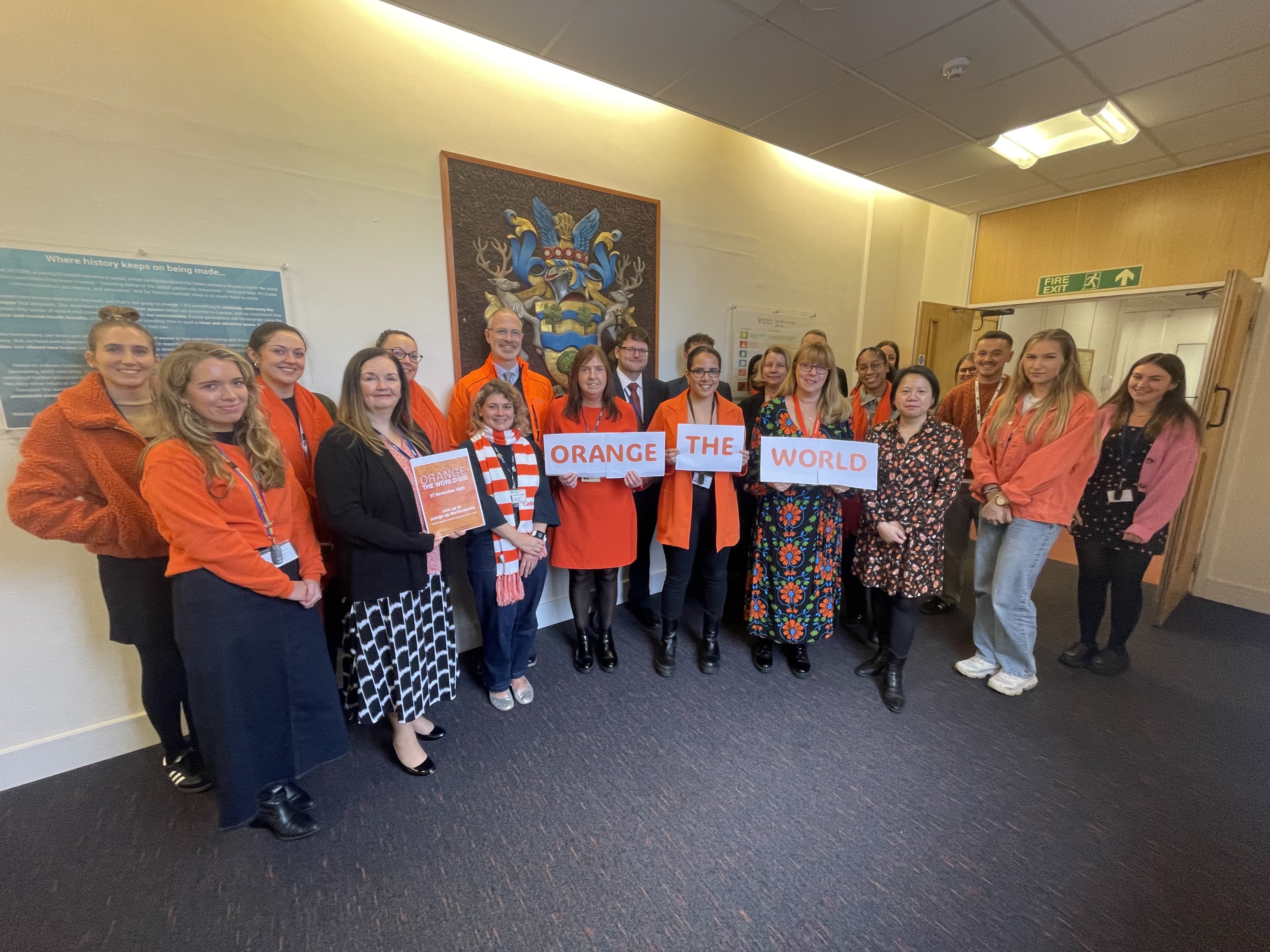 staff wearing orange