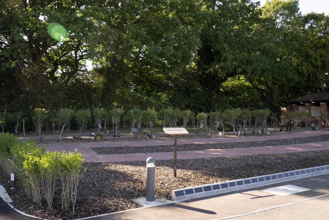 Rose garden with a plaque saying &#039;rose garden&#039; at Oak Hill