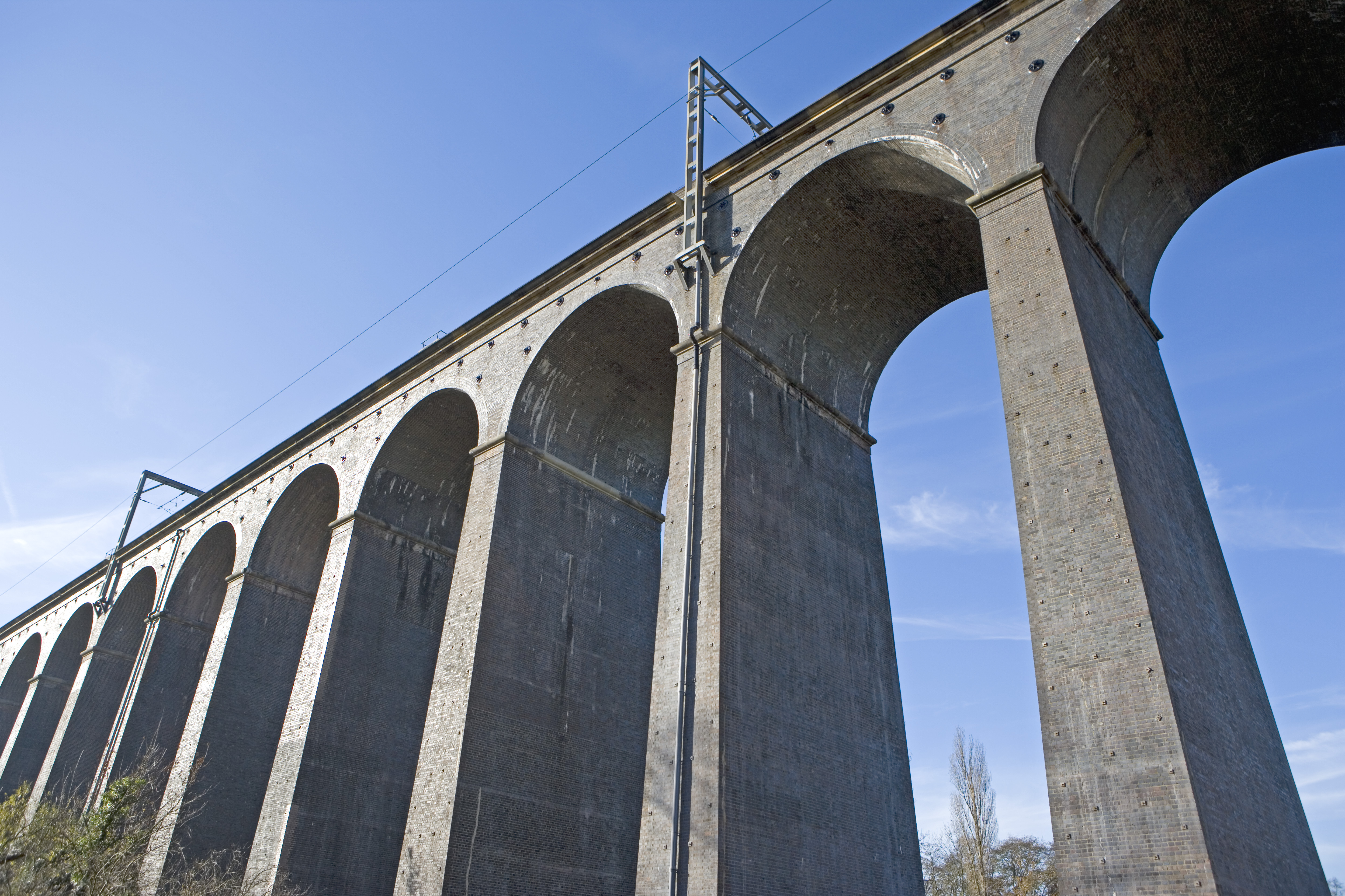 Welwyn viaduct with blue sky behind.